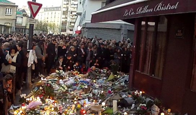 Group of people in front of café le carillon after the Paris attacks