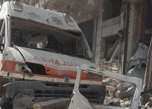 Syria, Aleppo, Al-Kallaseh district. The remains of an ambulance in the debris. 