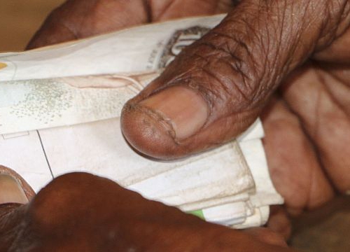 Tana Delta region, Kipao village. Haduko benefits of a cash assistance programme of the ICRC for people affected by the drought. The assistance is sent through a mobile money service, and the receiver then makes a cash withdrawal from a mobile money vendo