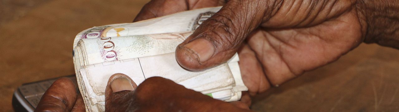 Tana Delta region, Kipao village. Haduko benefits of a cash assistance programme of the ICRC for people affected by the drought. The assistance is sent through a mobile money service, and the receiver then makes a cash withdrawal from a mobile money vendo