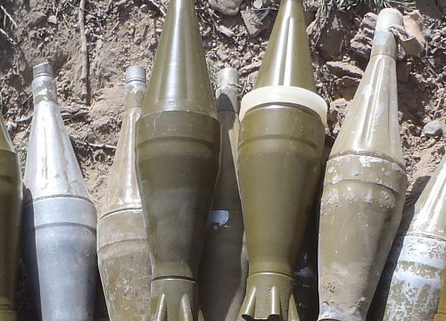 Members of an Afghan and coalition security force collected a cache of weapons during a security clearance of a known Haqqani Network foreign fighter encampment site. During the clearance over 50 insurgents were killed. Paktika province, Afghanistan, July