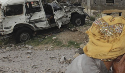 Yemen, Saada, Haydan district, Fawt. Looking at his destroyed home and smashed car, a man is overwhelmed by sadness. 