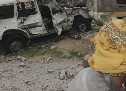 Yemen, Saada, Haydan district, Fawt. Looking at his destroyed home and smashed car, a man is overwhelmed by sadness. 