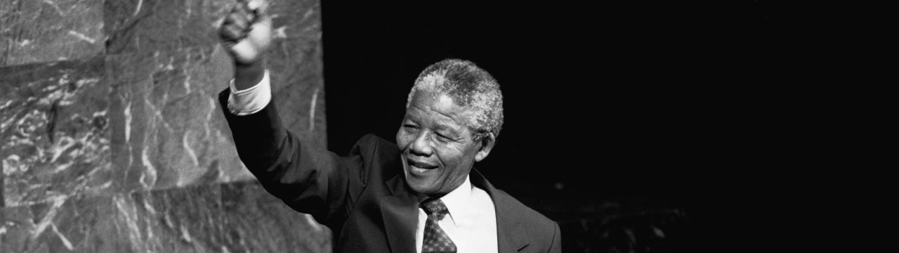  Nelson Mandela, Deputy President of the African National Congress of South Africa, raises his fist in the air while addressing the Special Committee Against Apartheid in the General Assembly Hall. 22 June 1990 