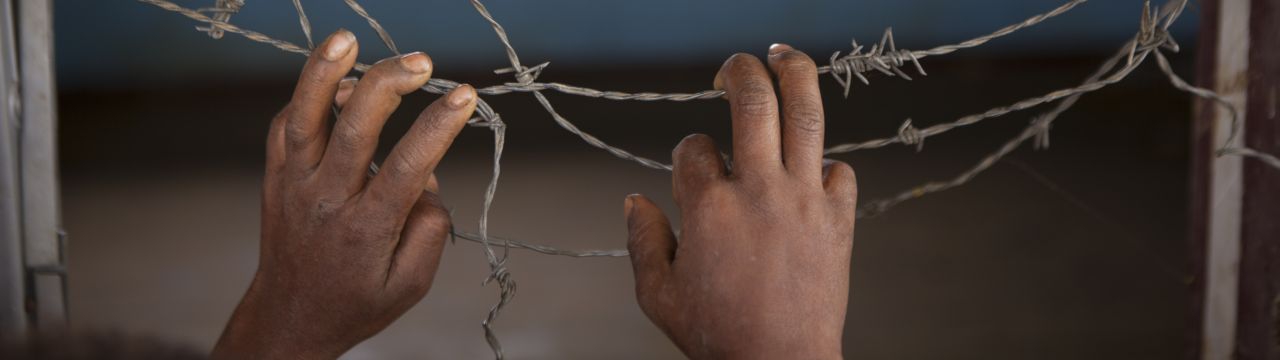 Papua New Guinea, Southern Highlands province, Katiloma. Barbed wires at the window of a clinic abandoned because of a tribal conflict.