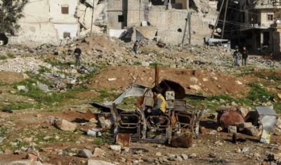  Outskirts of Aleppo. Kids playing with burnt chairs. 