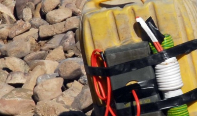 an Improvised Explosive Device while searching in the Mirabad Valley Region, Afghanistan 