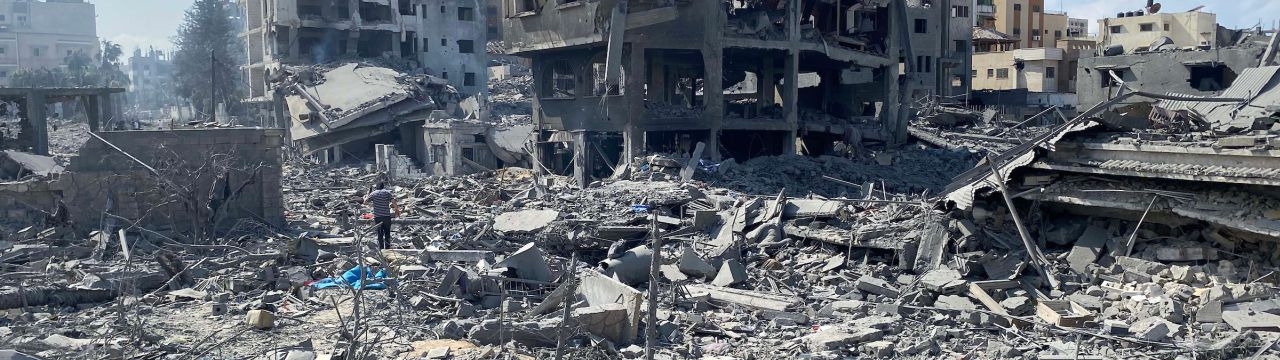  Palestinians inspect the damage following an Israeli airstrike on the El-Remal aera in Gaza City, October 2023.