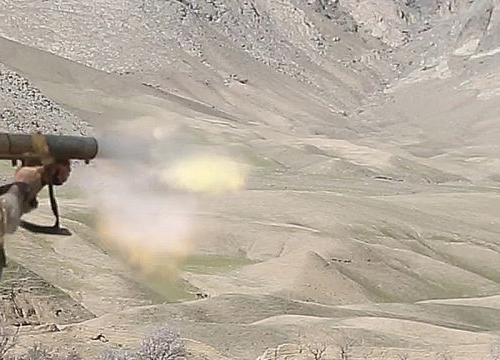 An U.S. Special Forces soldier assigned to Combined Joint Special Operations Task Force-Afghanistan fires a Carl Gustav recoilless rifle system after receiving small-arms fire during a clearance of Denasaro Kelay village in Mizan district, Zabul province,