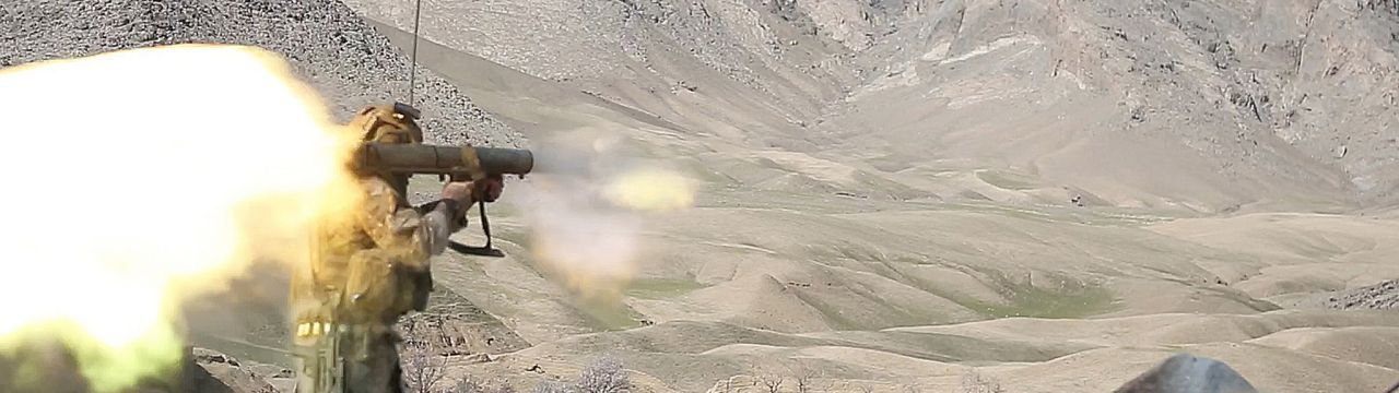 An U.S. Special Forces soldier assigned to Combined Joint Special Operations Task Force-Afghanistan fires a Carl Gustav recoilless rifle system after receiving small-arms fire during a clearance of Denasaro Kelay village in Mizan district, Zabul province,