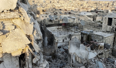 Syria, Old city of Aleppo. Destructed houses situated next to the frontline stand side by side alongside intact houses full of occupants just a few meters away from the frontline