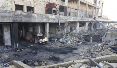 Syria, destroyed building and ambulance