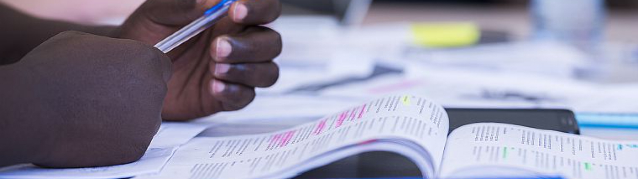 Student's hands with a pen