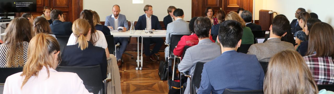 Photo of the conference room with participants