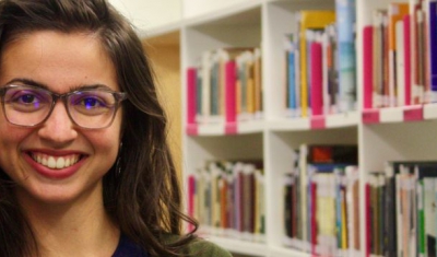 Portrait of Anthoula Bourolias in the Library of the Graduate Institute of International and Development Studies