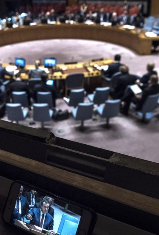 A wide view of the Security Council Chamber as Zahir Tanin (shown on screen), Special Representative of the Secretary-General and Head of the United Nations Interim Administration Mission in Kosovo (UNMIK), briefs the Council via video conference.