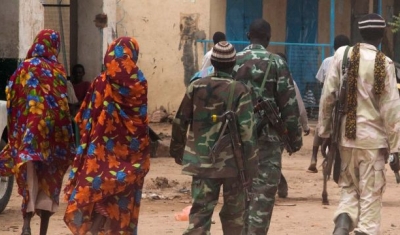 Kutum, North Darfur: Members of the Sudanese army patrol Kutum market