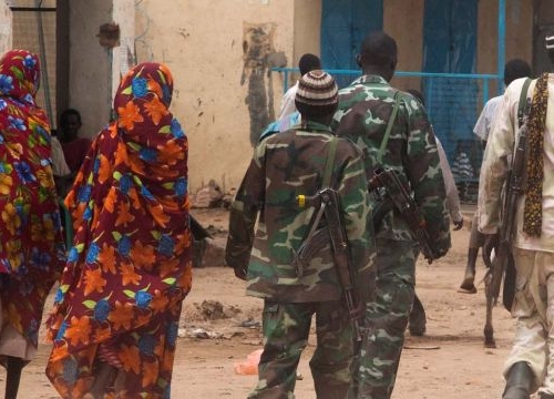 Kutum, North Darfur: Members of the Sudanese army patrol Kutum market