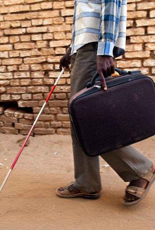 El Fasher: Salahdin Abdurrahman Khissan, a 17-years-old blind student, walks with his stick at the Sudanese Association for Disabled People in El Fasher, North Darfur.