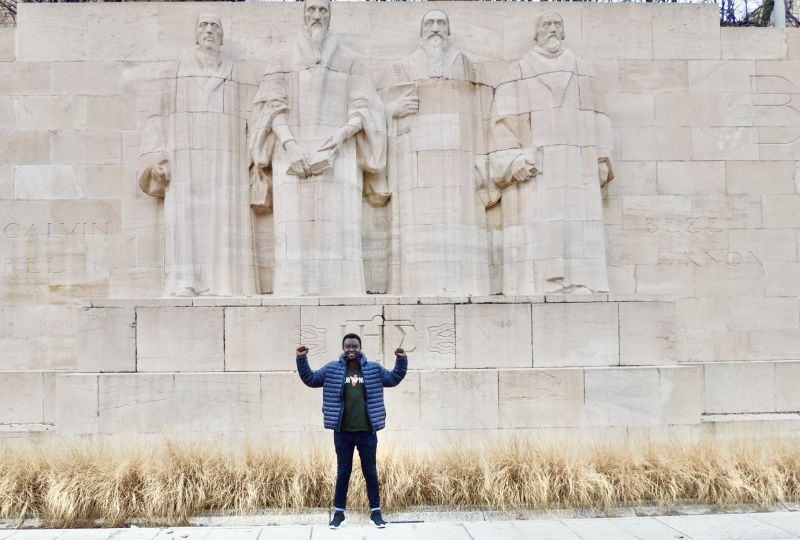 Jean-Paul Nizigiyimana in front of the Mur des Réformateurs in Geneva