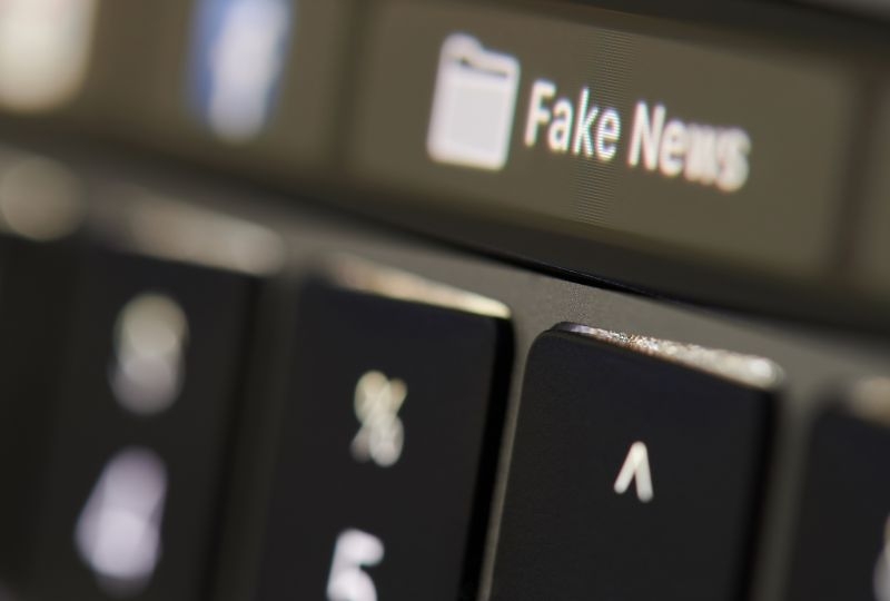 Fake news written on a keyboard