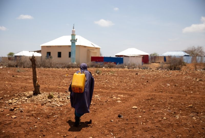 Kids walking home after water distribution during deadly drought in Somalia
