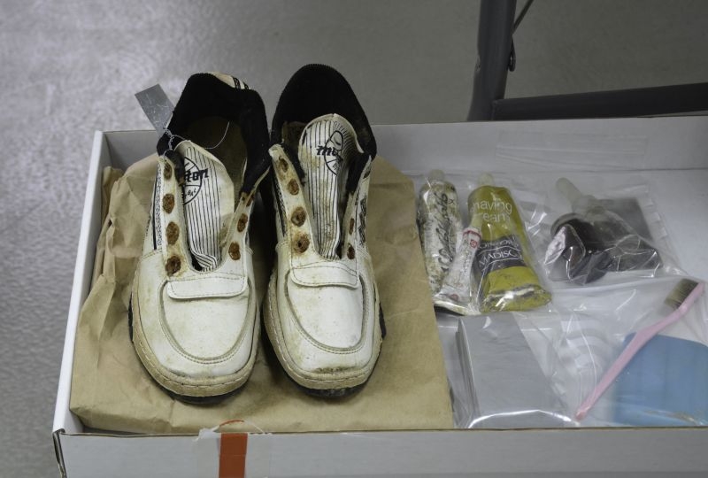 Georgia,  Tbilisi, National Forensic Bureau. Artefacts found together with missing persons in the graves, prepared for the families to view, if they wish. 