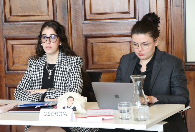 Two students at the pleadings on the 2008 armed conflict in South Ossetia