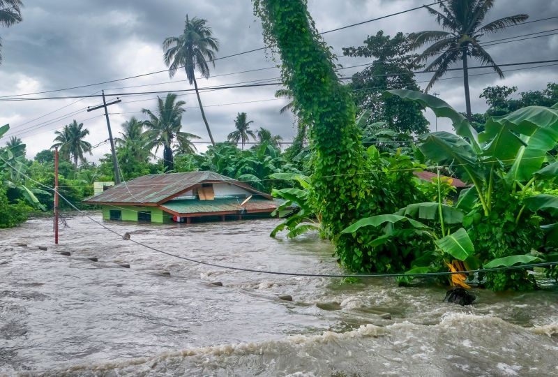 Rising water levels submerging a house as heavy monsoon rains cause major floods in Baco, Oriental Mindoro, Philippines on July 23, 2021.